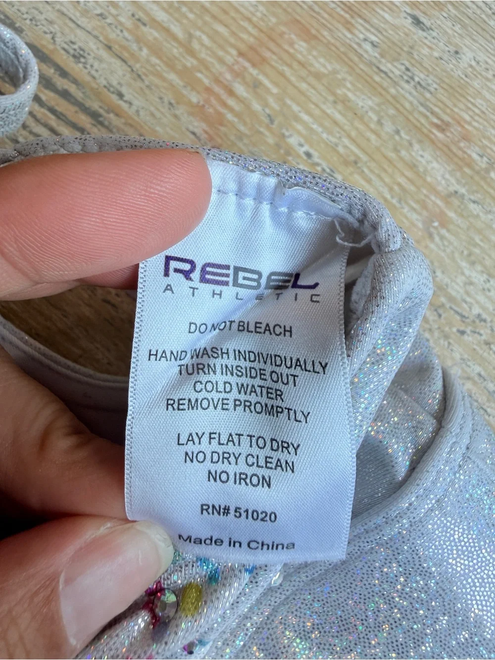 Rebel Athletic Women’s Sparkle Confetti Sports Bra with 'REBEL' Graphic - Silver